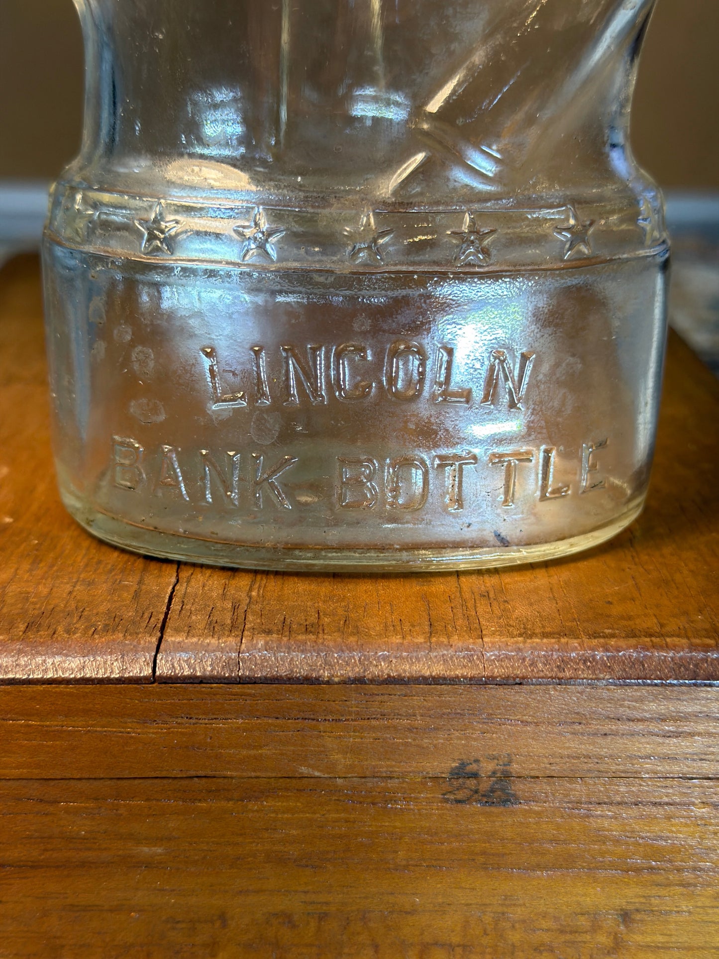 LINCOLN COIN BANK BOTTLE