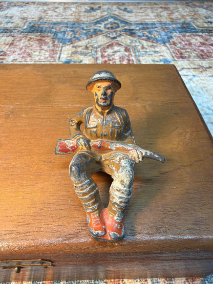 1930'S M59 MANOIL TOY SITTING SOLDIER