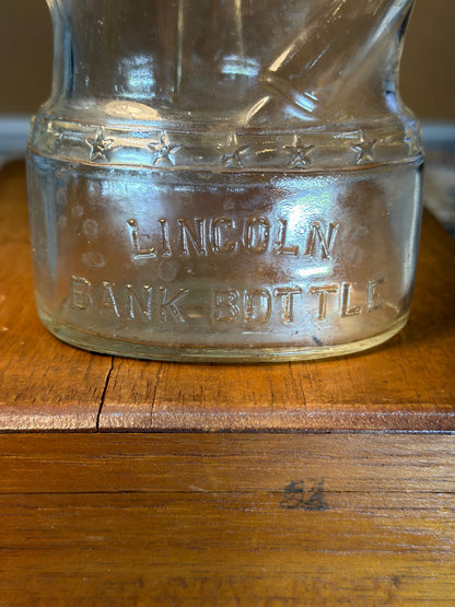 LINCOLN COIN BANK BOTTLE