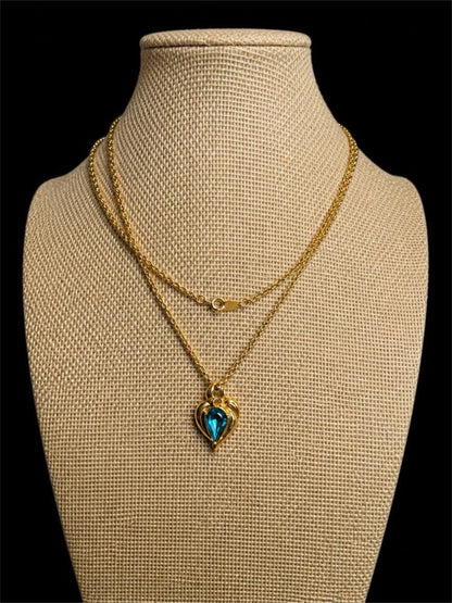 1994 AVON BLUE RHINESTONE IN GOLD NECKLACE