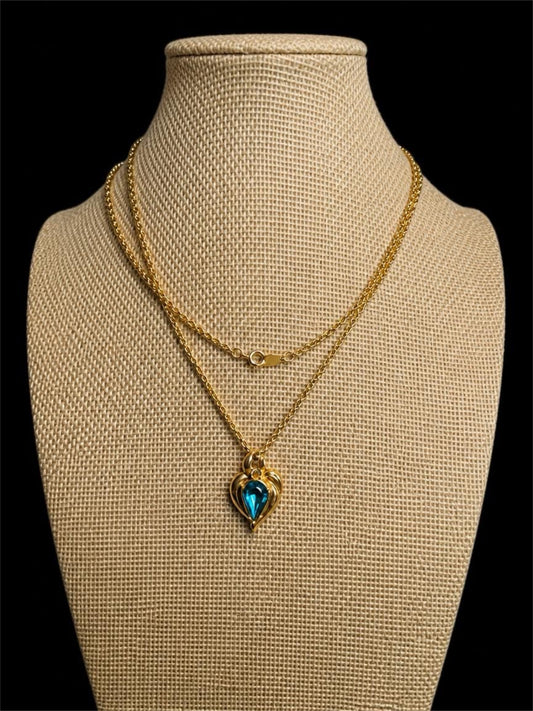 1994 AVON BLUE RHINESTONE IN GOLD NECKLACE